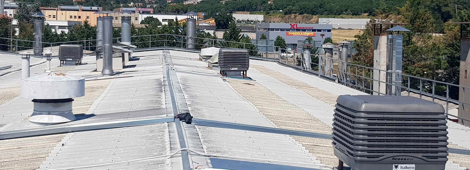 Breezair evaporative coolers installed on production plant warehouse rooftop