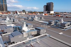 Commercial HVAC systems installed across a rooftop for large building cooling