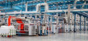 Commercial HVAC systems providing ventilation in a large manufacturing facility
